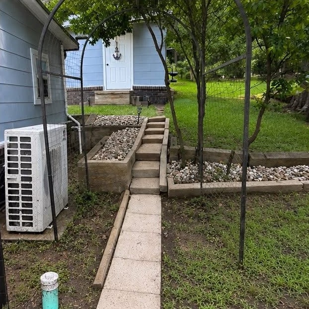 The same walkway and steps after cleaning, back to a pale stone colour